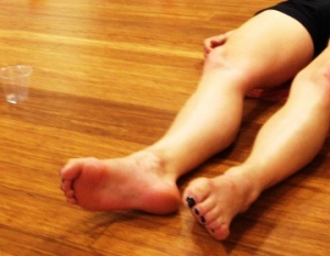 The feet and legs in savasana