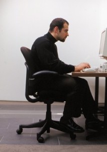 sitting at a computer